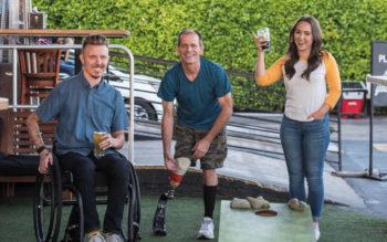 Friends with disabilities drinking beer.